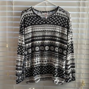 The brand is Matilda Jane. The size is a 16. Black and white top.